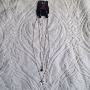 Layered necklace including matching earrings